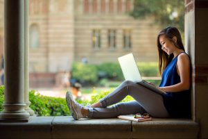 Female college student writing paper